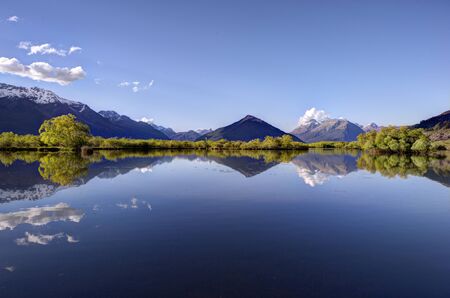 Reflection of the mountains on the lagoon at Glenorchy, New Zealand の写真素材