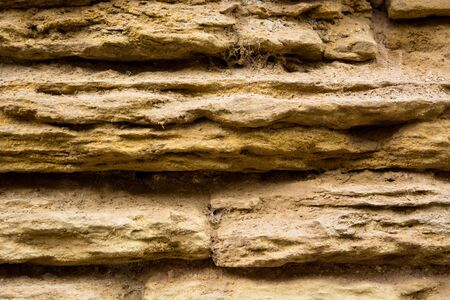 Detail of an ancient eroded stone wall