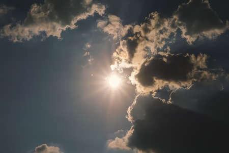 Cloudscape has been developing in gorgeous form. The sun is shining through the clouds.の写真素材