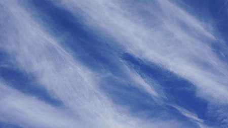 blue sky background with white clouds. Beautiful cirrus clouds in the blue sky.