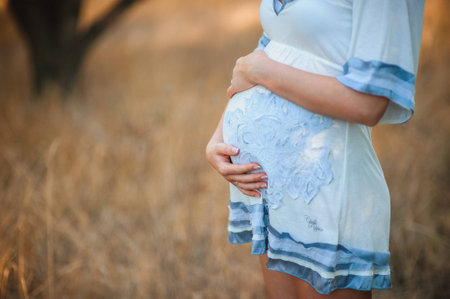 pregnant woman touching her stomachの写真素材