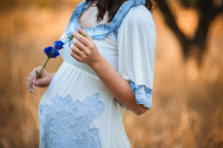 pregnant woman touching her stomachの写真素材
