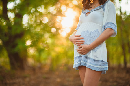pregnant woman touching her stomachの写真素材