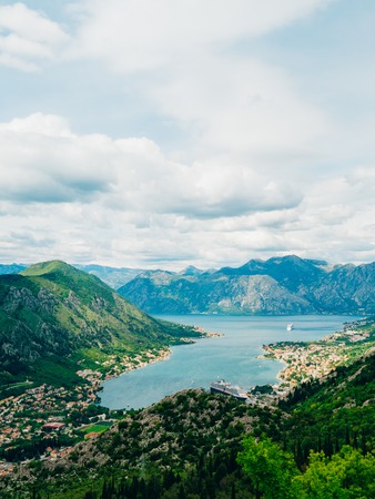 Bay of Kotor from the heights. View from Mount Lovcen to the bay. View down from the observation platform on the mountain Lovcen. Mountains and bay in Montenegro. The liner near the old town of Kotor.の写真素材
