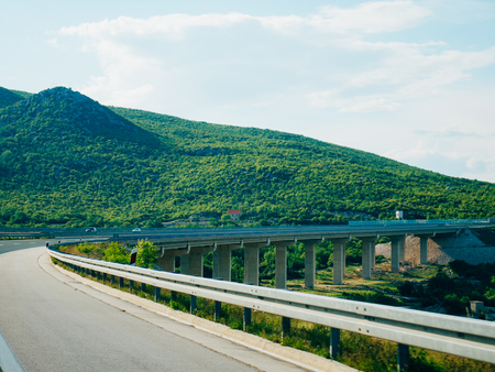 Highway. Motorway in Croatia. View of the car. The mountains and the horizon line at the backgroundの写真素材