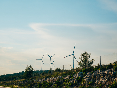 Wind power plant in the fields and mountains of Croatia.の写真素材