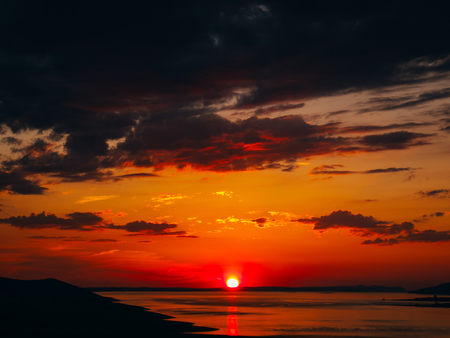 Sunset over the sea. Sunset over the Adriatic Sea. Sun to sit down in the waterの写真素材