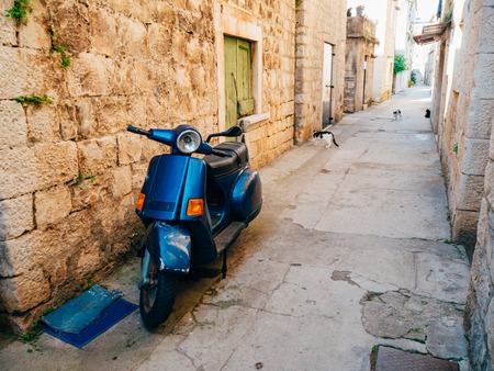 Retro Scooter for hipsters on the streets of Croatia and Montenegro. A small malotrade moped.の写真素材