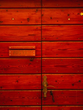 Old yellow, brown, red doors. Wood texture. Old shabby irradiated paintの写真素材