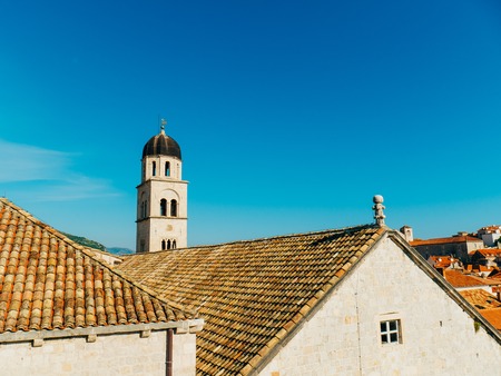 Dubrovnik Old Town, Croatia. Tiled roofs of houses. Church in the city. City View from the wall.の写真素材