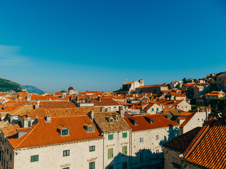 Dubrovnik Old Town, Croatia. Tiled roofs of houses. Church in the city. City View from the wall.の写真素材