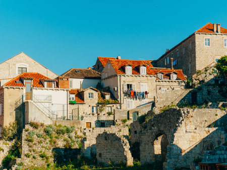 Dubrovnik Old Town, Croatia. Tiled roofs of houses. Church in the city. City View from the wall.の写真素材