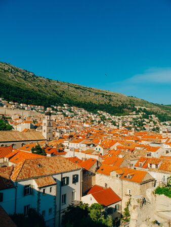 Dubrovnik Old Town, Croatia. Tiled roofs of houses. Church in the city. City View from the wall.の写真素材