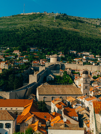 Dubrovnik Old Town, Croatia. Tiled roofs of houses. Church in the city. City View from the wall.の写真素材