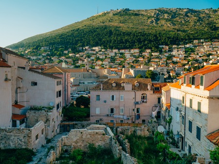 Dubrovnik Old Town, Croatia. Tiled roofs of houses. Church in the city. City View from the wall.の写真素材