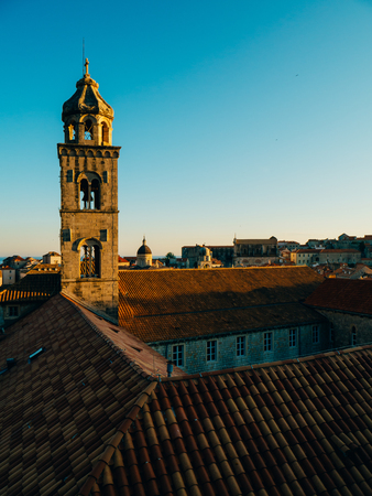Dubrovnik Old Town, Croatia. Tiled roofs of houses. Church in the city. City View from the wall.の写真素材