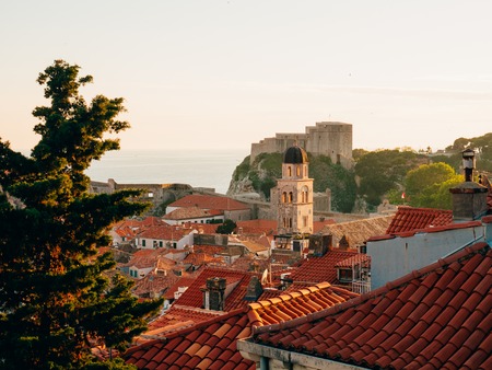 Dubrovnik Old Town, Croatia. Tiled roofs of houses. Church in the city. City View from the wall.の写真素材