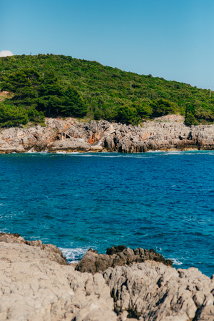 Rocks on the sea in Montenegro. Rocky coast. Wild beach. Dangerous coast.の写真素材