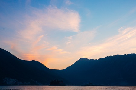 Sunset in the Bay of Kotor. Montenegrin sunsets. Sunset over the sea and the mountains.の写真素材