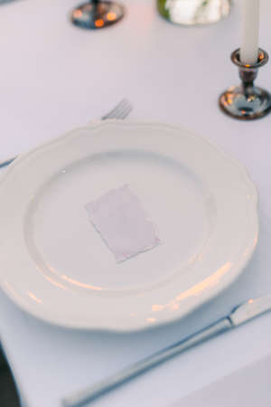 Plates at the wedding banquet. Table setting. Wedding decorations. Wedding at the sea in Montenegro.