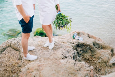 Wedding bridal bouquet of roses, lisianthus, lavender, Gypsophila, Verdure Italian in the hands of the bride. Wedding in Croatia, Dubrovnik.の写真素材