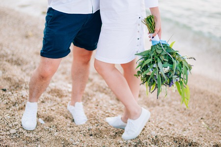 Wedding bridal bouquet of roses, lisianthus, lavender, Gypsophila, Verdure Italian in the hands of the bride. Wedding in Croatia, Dubrovnik.の写真素材