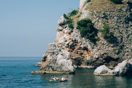 Kayaks at sea. Tourist kayaking in the sea near Dubrovnik, Croatia. Aerial Photo drone.の写真素材