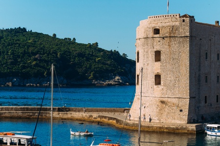 The boat dock near the old city of Dubrovnik, Croatia. The harbor, a marina, near the ancient city.の写真素材
