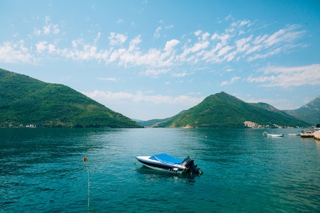 The old town of Perast on the shore of Kotor Bay, Montenegro. The ancient architecture of the Adriatic and the Balkans. Boats and yachts on the dock.の写真素材