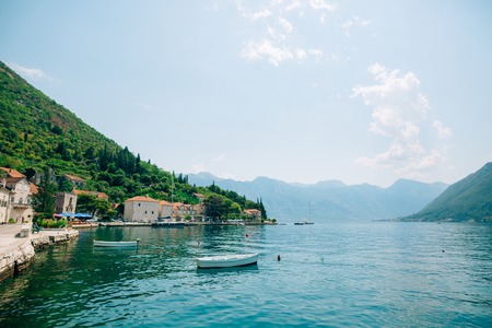 The old town of Perast on the shore of Kotor Bay, Montenegro. The ancient architecture of the Adriatic and the Balkans. Boats and yachts on the dock.の写真素材