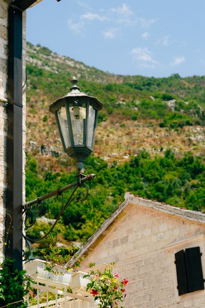 Vintage lamp on the wall on the street.の写真素材