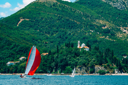 Sailing regatta in Montenegro. Regatta on yachts in the Boka Bay of Kotor in the Adriatic Sea. Sports competitions on yachts.の写真素材
