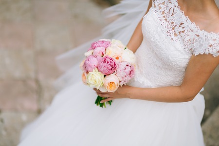 Wedding roses and peonies in the hands of the bride. Wedding in Montenegro.の写真素材