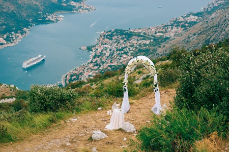 A wedding in the mountains. Wedding arch for the ceremony on the summit of Mount Lovcen in Montenegroの写真素材