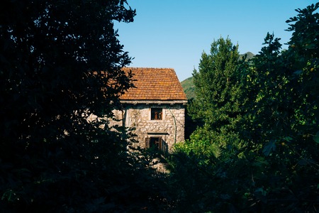 The house with orange tiled roof. Houses in Croatia and Montenegro.の写真素材