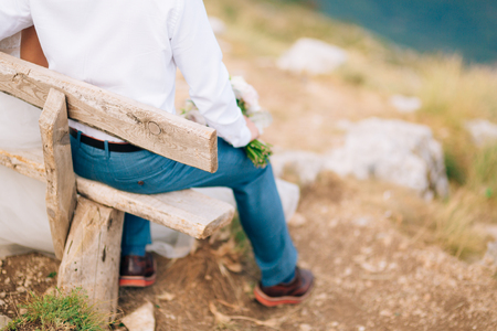 Brown shoes on male legs. The groom in a blue pants.の写真素材