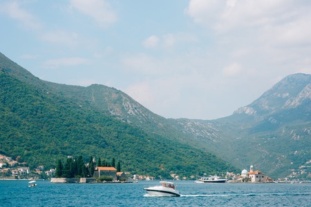 The old town of Perast on the shore of Kotor Bay, Montenegro. The ancient architecture of the Adriatic and the Balkans. Boats and yachts on the dock.の写真素材