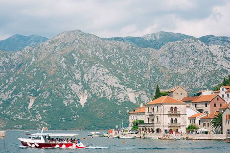 The old town of Perast on the shore of Kotor Bay, Montenegro. The ancient architecture of the Adriatic and the Balkans. Boats and yachts on the dock.の写真素材