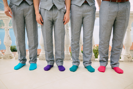Men in colorful socks. Funny wedding photos. Wedding in Montenegro.の写真素材