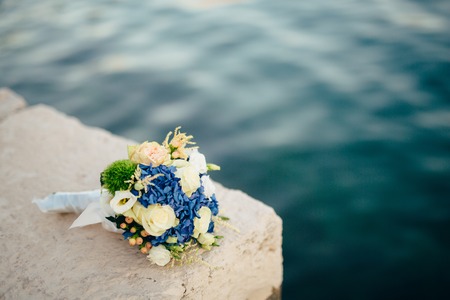 Wedding bridal bouquet of Hydrangeas, Astilba, Lisianthus on a sea berth. Wedding in Montenegro, Adriatic.の写真素材