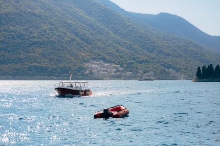 Boat in the Bay of Kotor. Montenegro, the water of the Adriatic Sea. Boats, yachts, liners.の写真素材
