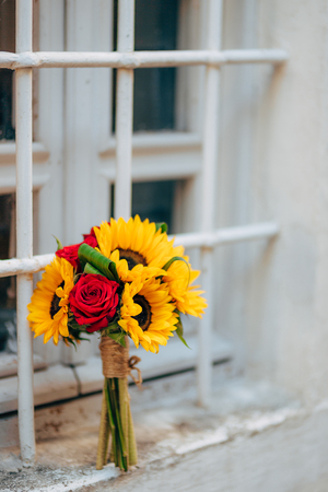 Wedding bridal bouquet of sunflowers on the window. Wedding in Montenegro, Perast.の写真素材