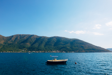 The old town of Perast on the shore of Kotor Bay, Montenegro. The ancient architecture of the Adriatic and the Balkans. Boats and yachts on the dock.の写真素材