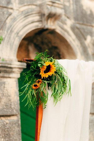 Wedding Arch of sunflowers. The ceremony at the St. Nikola Church in Perast, Montenegroの写真素材
