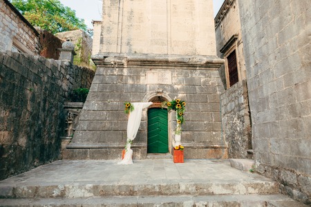 Wedding Arch of sunflowers. The ceremony at the St. Nikola Church in Perast, Montenegroの写真素材