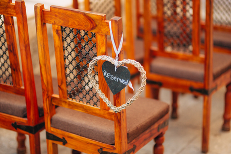 Plate Reserved on the chair at the wedding. Chairs at the wedding ceremony. Wedding in Montenegro.の写真素材