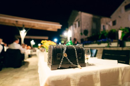 Chest with chain and lock on the table.の写真素材