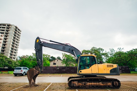 Excavator at a construction site. Building a house in Montenegro, Budva.