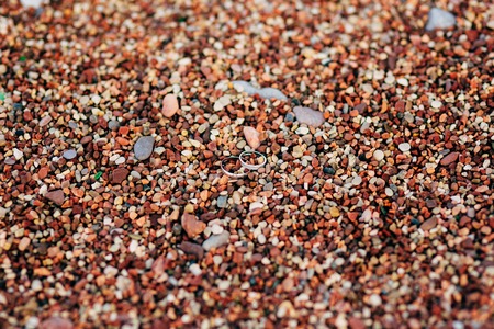 Wedding rings on the beach pebbles. Wedding jewelry. Sea Wedding.の写真素材