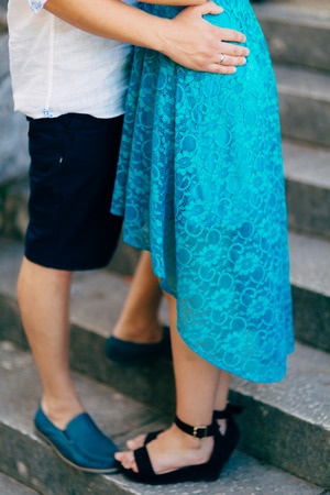 The groom embraces the bride in the old town. Wedding in Montenegro and Croatia.の写真素材